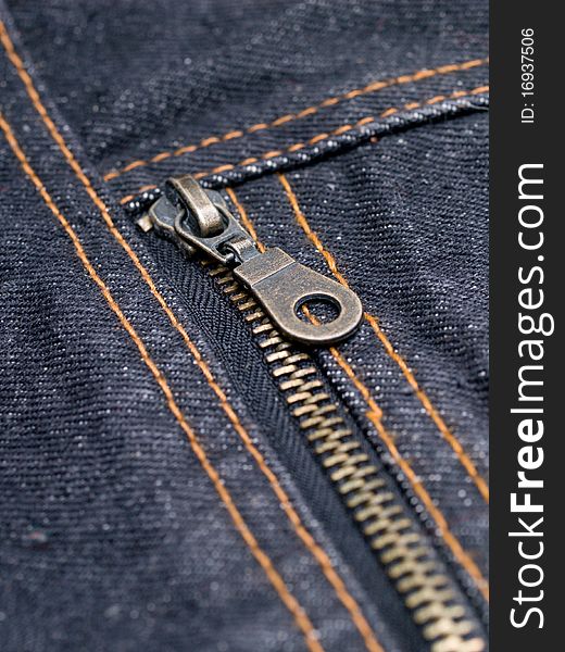 Buttoned zipper on dark jeans closeup