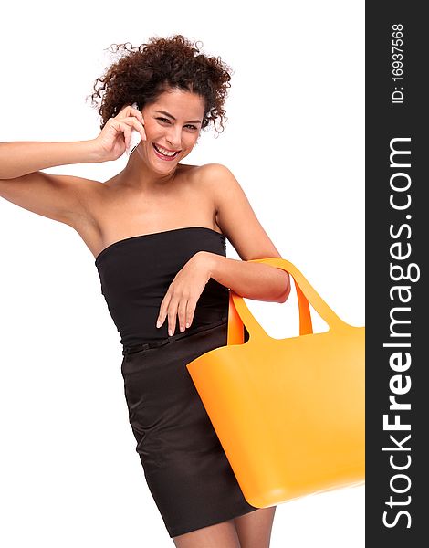 smiling woman on the phone with a shopping-bag. smiling woman on the phone with a shopping-bag