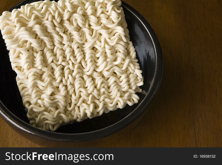 Instant noodle in black bowl