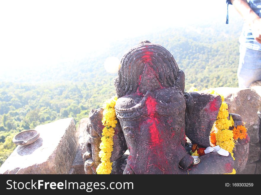 Picture of Close head Shot of Ganesh Lord at Dholkal Trek.This place is great for trekking lover with some edge level climbing with high ditch around 
this.

Location-Dholkal Trek,Dantewada