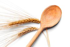 Ear Of Wheat And Wooden Spoon Royalty Free Stock Images