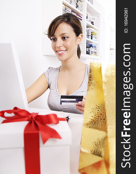 Happy shopping on-line of young woman with laptop on internet. Happy shopping on-line of young woman with laptop on internet