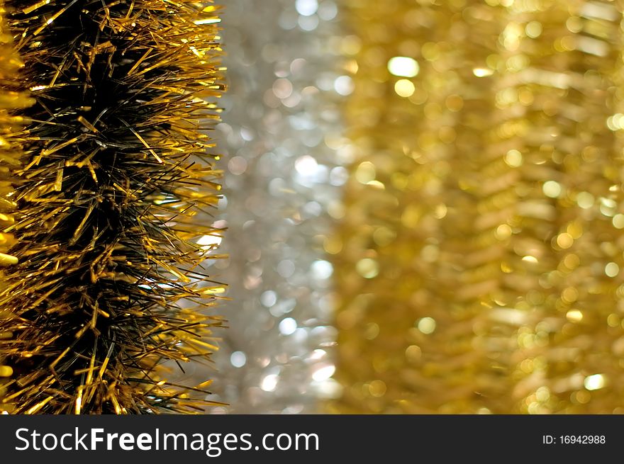 Golden christmas chain on bokeh background