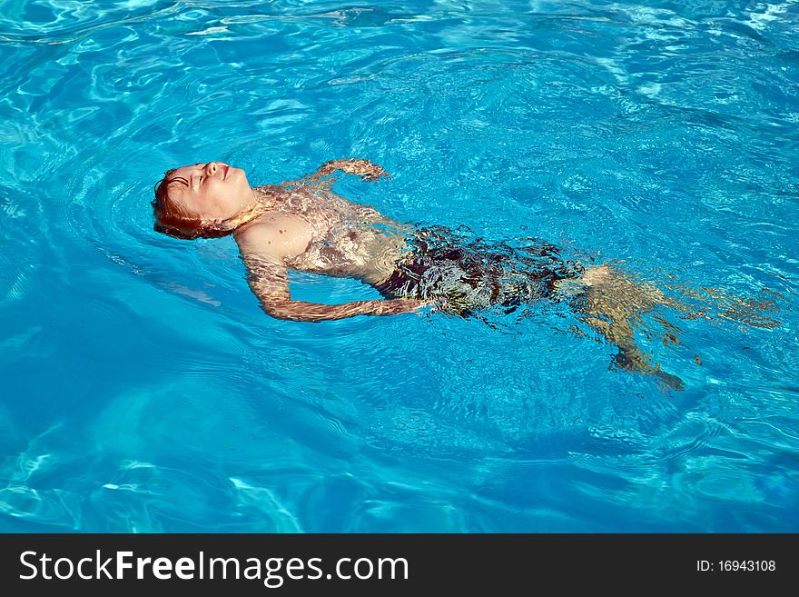 Child Has Fun In The Pool