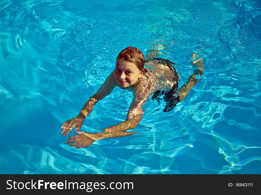 Child Has Fun In The Pool