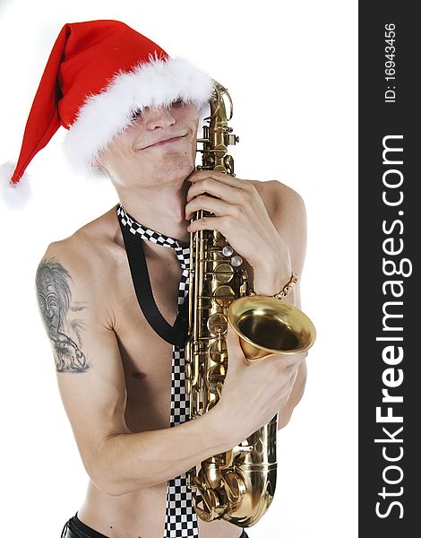 Young Santa embraces a saxophone