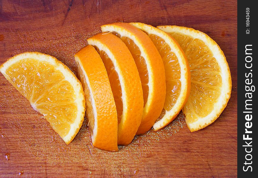 Orange on wood board in kitchen