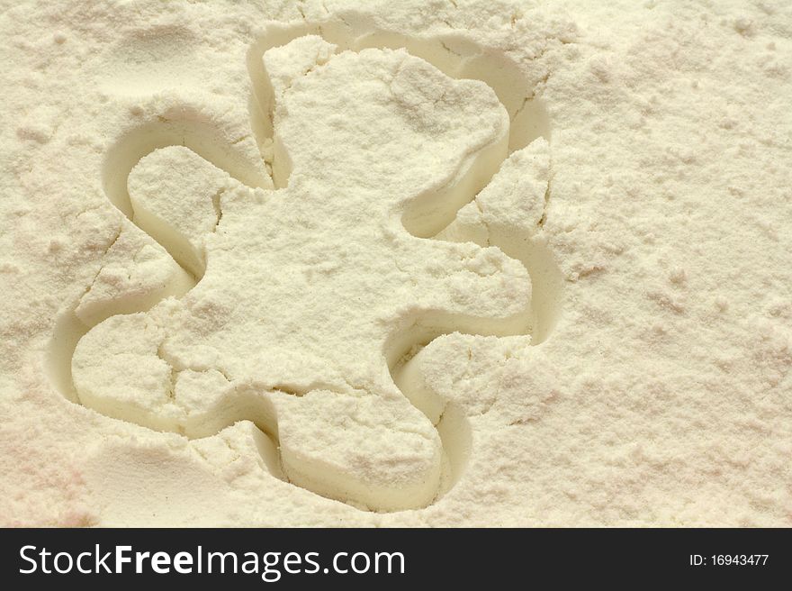 Bear shape pressed into flour. Bear shape pressed into flour