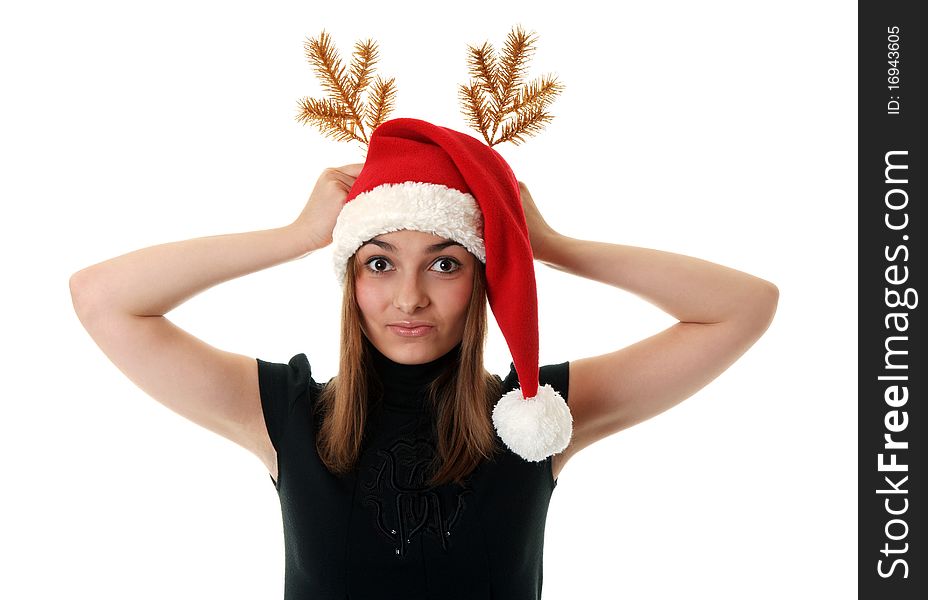 Beautiful girl in red hat santa and golden branch on white background