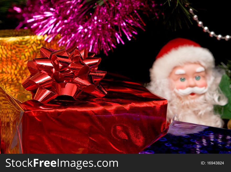 Christmas tree with gold ornament ball, close up