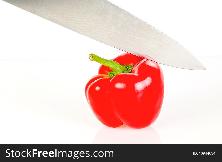 Paprika and knife isolated on white background. Paprika and knife isolated on white background