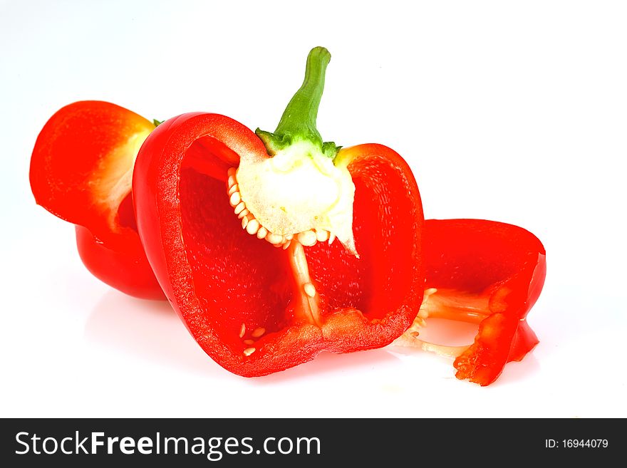 Sliced red paprika isolated on white background