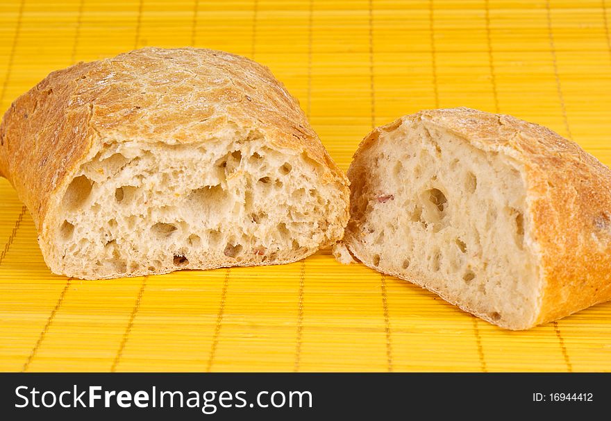 Fresh bread on yelloy background