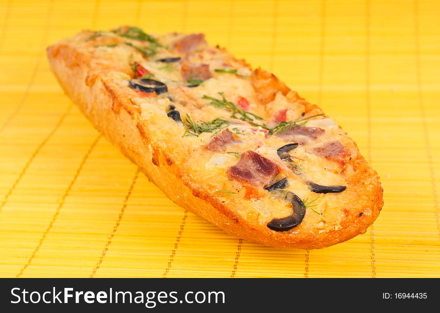Closeup picture of pizza with meat and olives