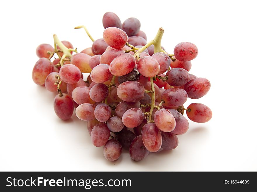 Red bunches of grapes onto white background