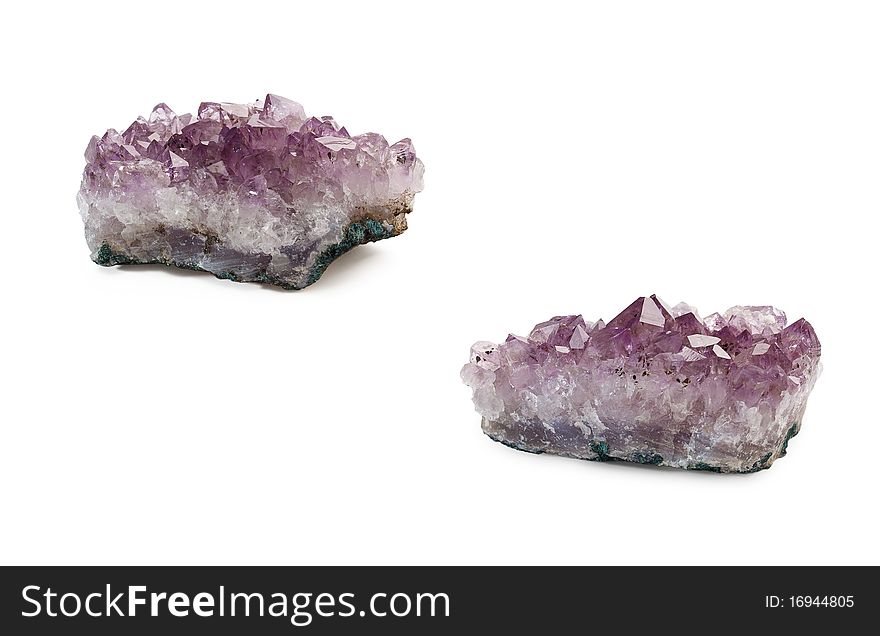 Crystals of amethyst are isolated on a white background