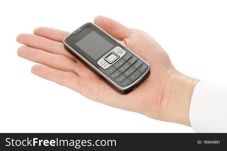 Cell phone in a hand isolated on white