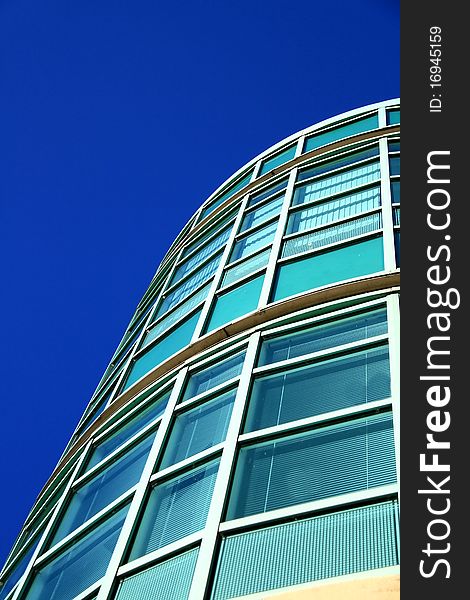 Image of an office building on a sunny day. Image of an office building on a sunny day