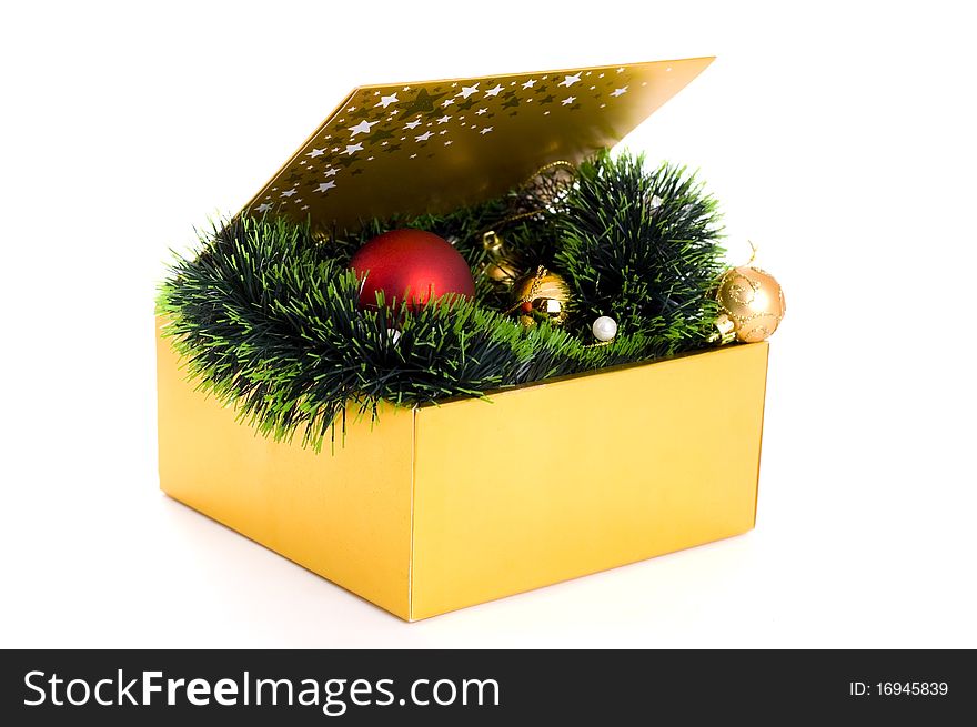 Golden box with christmas balls isolated on white background. Golden box with christmas balls isolated on white background