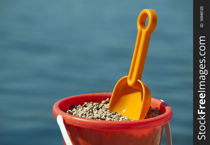 Bucket with sand in the sea. Bucket with sand in the sea