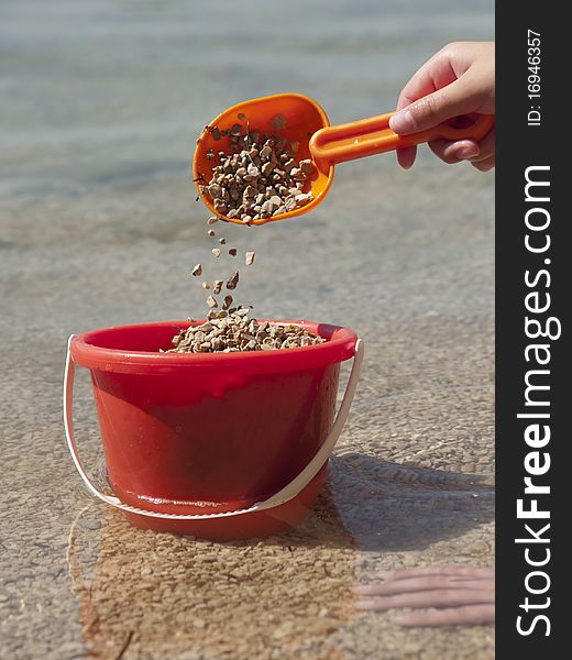 Bucket with sand in the sea. Bucket with sand in the sea