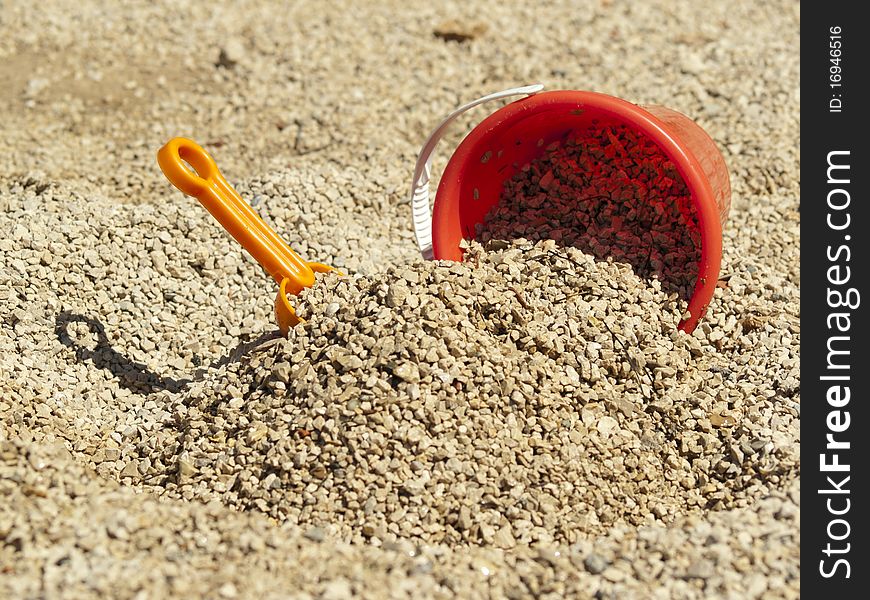 Bucket in the sand on the sea coast