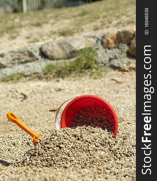 Bucket in the sand on the sea coast