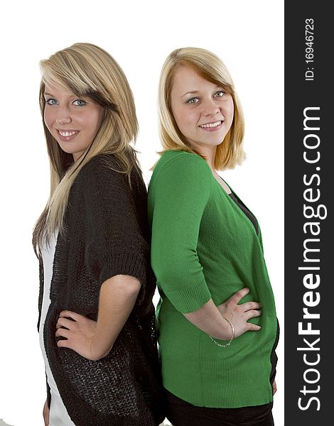 Two young caucasian girlfriends having fun together  isolated over white background. Two young caucasian girlfriends having fun together  isolated over white background