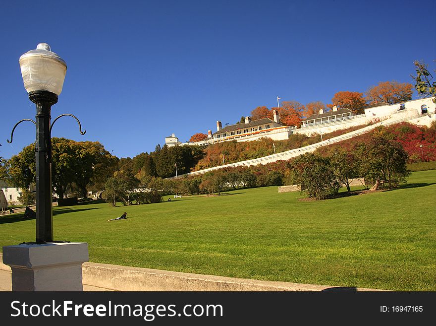 View of Fort Mackinac from the water front with green space in foreground