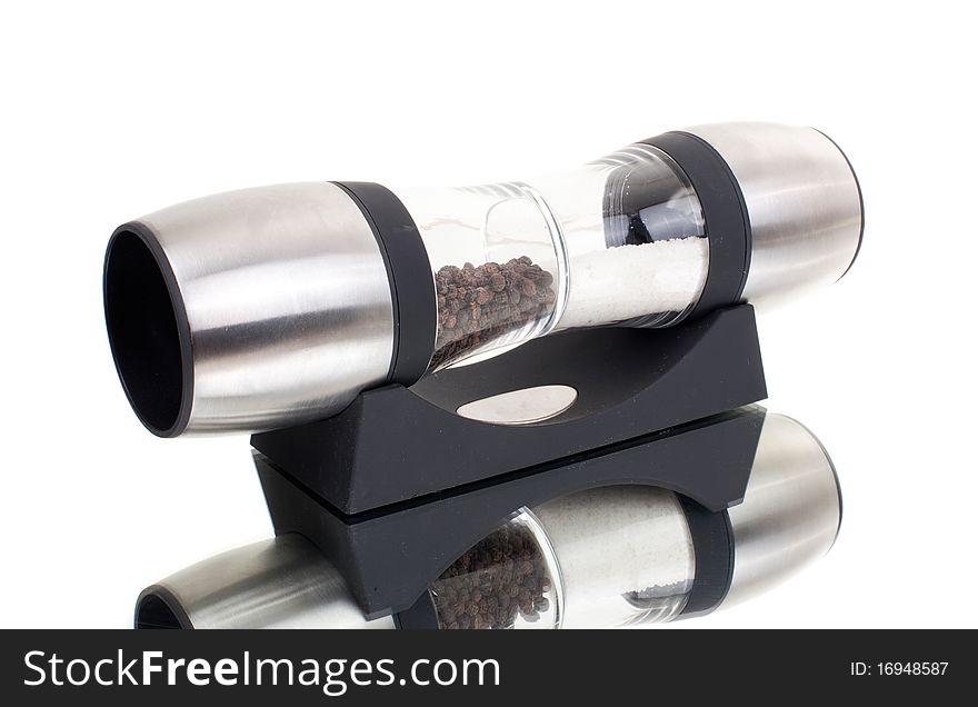 Series. A glass grinder of pepper isolated on a white background