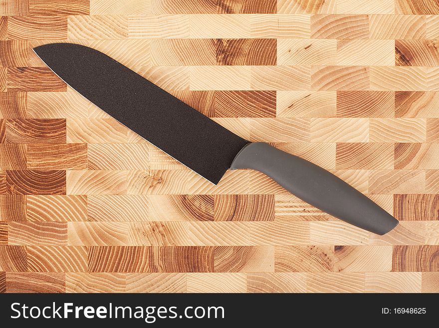 Kitchen knifes isolated on wooden background