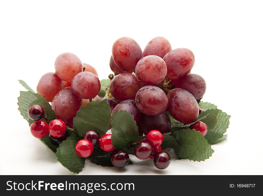 Red grapes in the wreath with berries