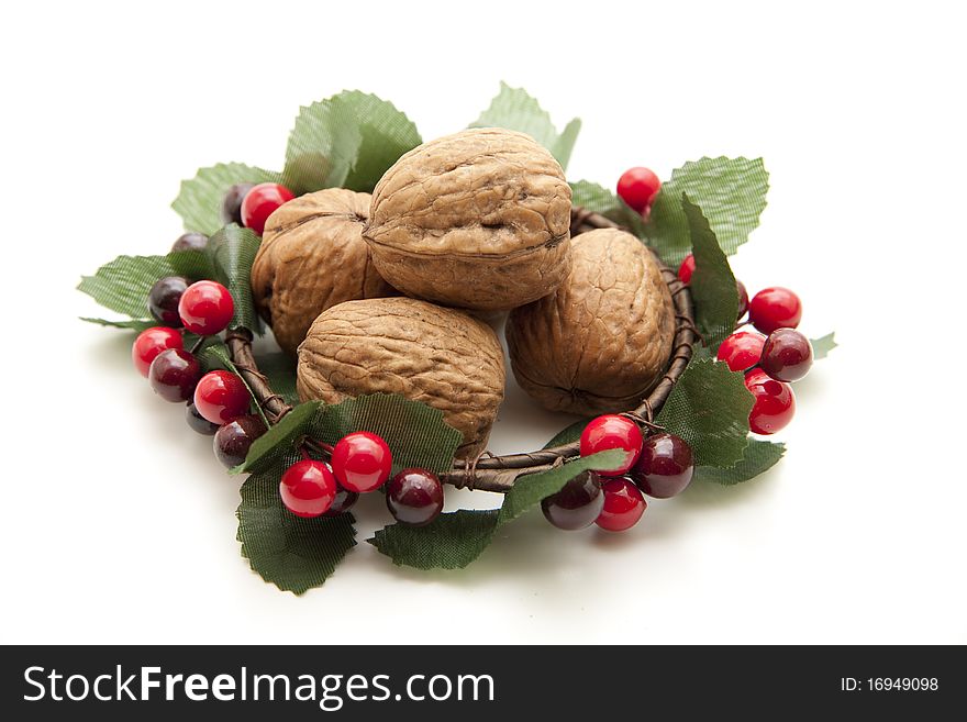 Walnuts in the wreath with berries
