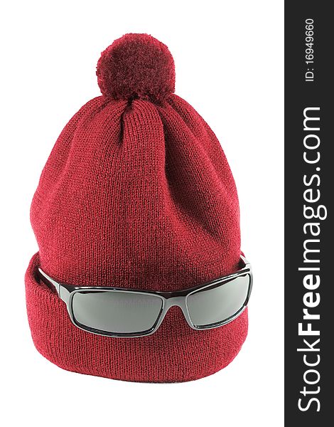 Wool Cap red with glasses on a white background. Wool Cap red with glasses on a white background