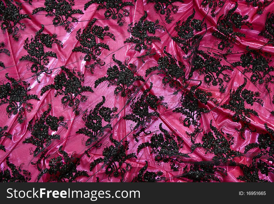 Satin fabric with pink embroidery