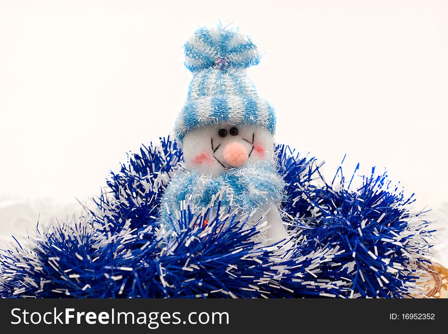 Snowman christmas-tree decorations on the background