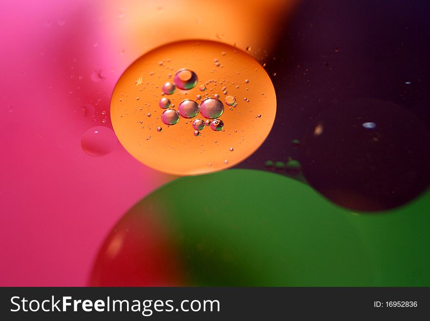 Macro shot of oil and water as background. Macro shot of oil and water as background