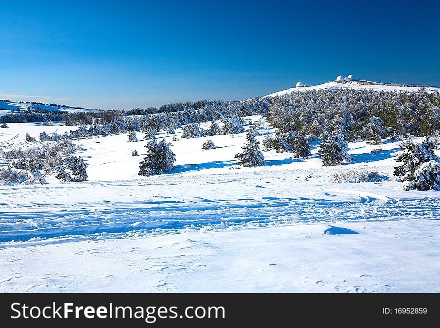 Beautiful view an a snowbound valley. Beautiful view an a snowbound valley