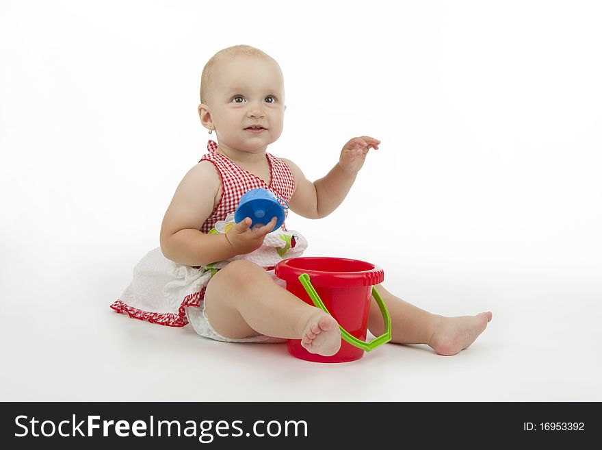 Infant with pail and pie, on white background. Infant with pail and pie, on white background.