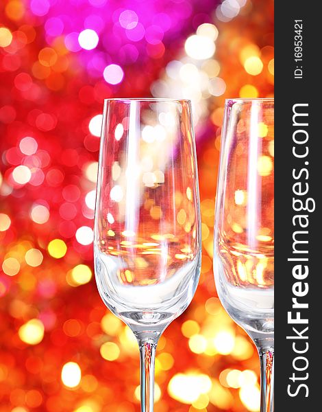 Two empty glasses for champagne on the blurred background. Two empty glasses for champagne on the blurred background