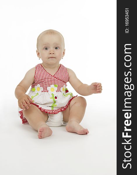 Infant sit, on white background.