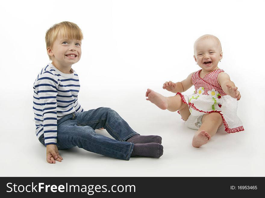 Smiling boy and girl, on white background. Smiling boy and girl, on white background.