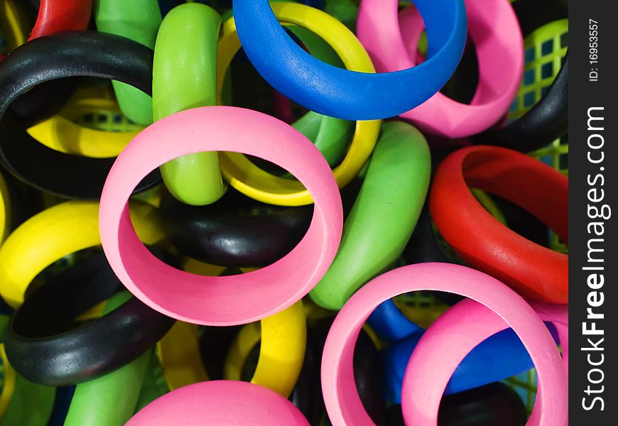 Trendy colorful wooden bracelets closeup