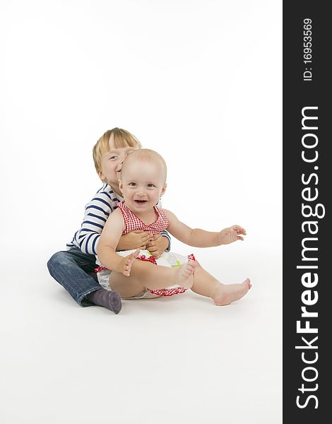 Boy and his sister, on white background. Boy and his sister, on white background.