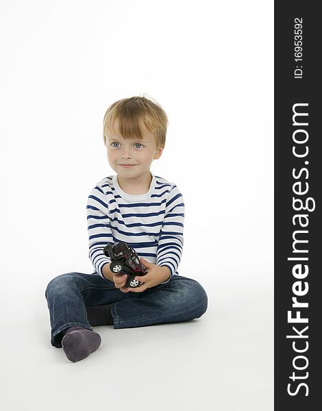 Boy with toy - car, on white background.