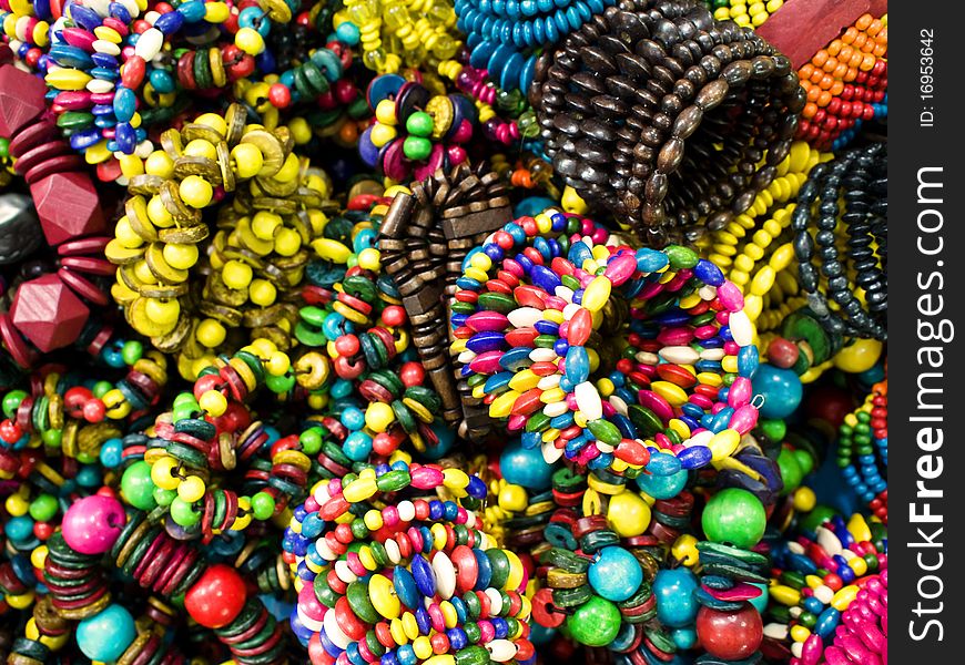 Trendy colorful wooden bracelets closeup