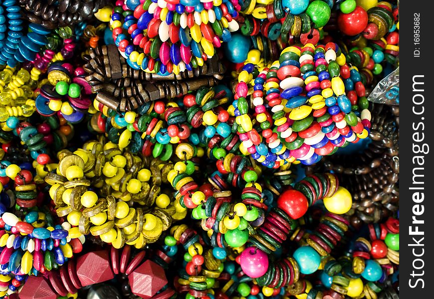 Trendy colorful wooden bracelets closeup