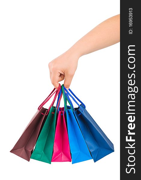 Hand with shopping bags isolated on white background