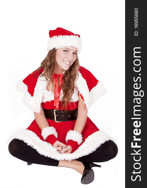 A woman dressed like Mrs Santa is sitting. A woman dressed like Mrs Santa is sitting.