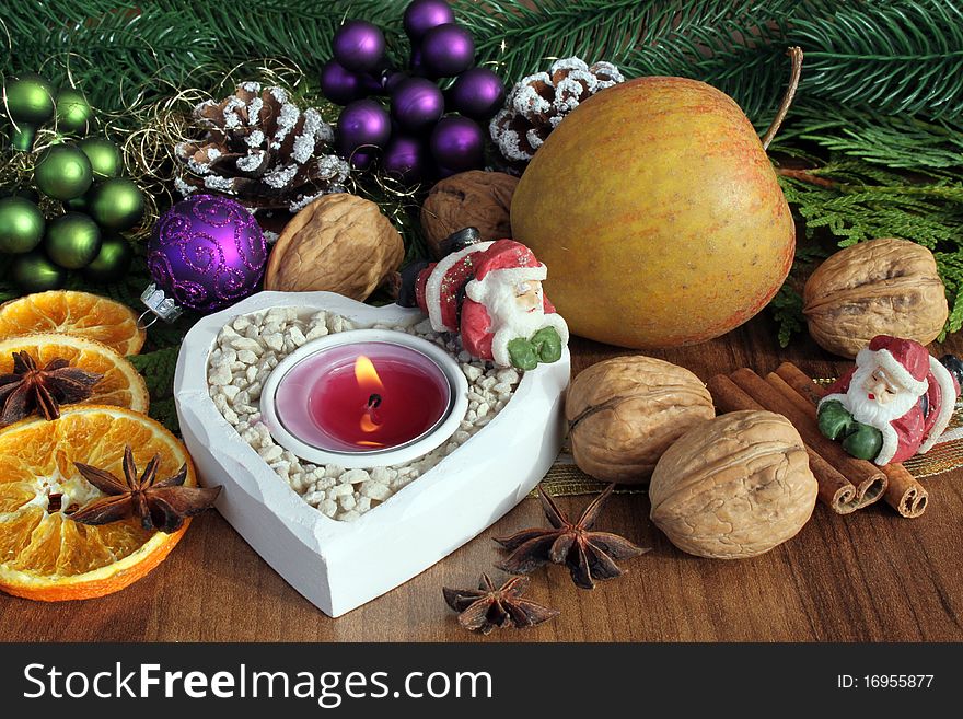 Burning candle with christmas decoration. Burning candle with christmas decoration